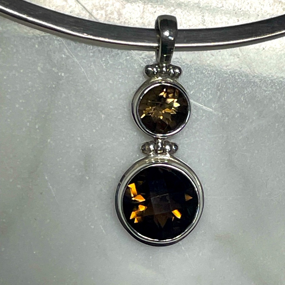 Silver drop pendant with two brown topaz stones